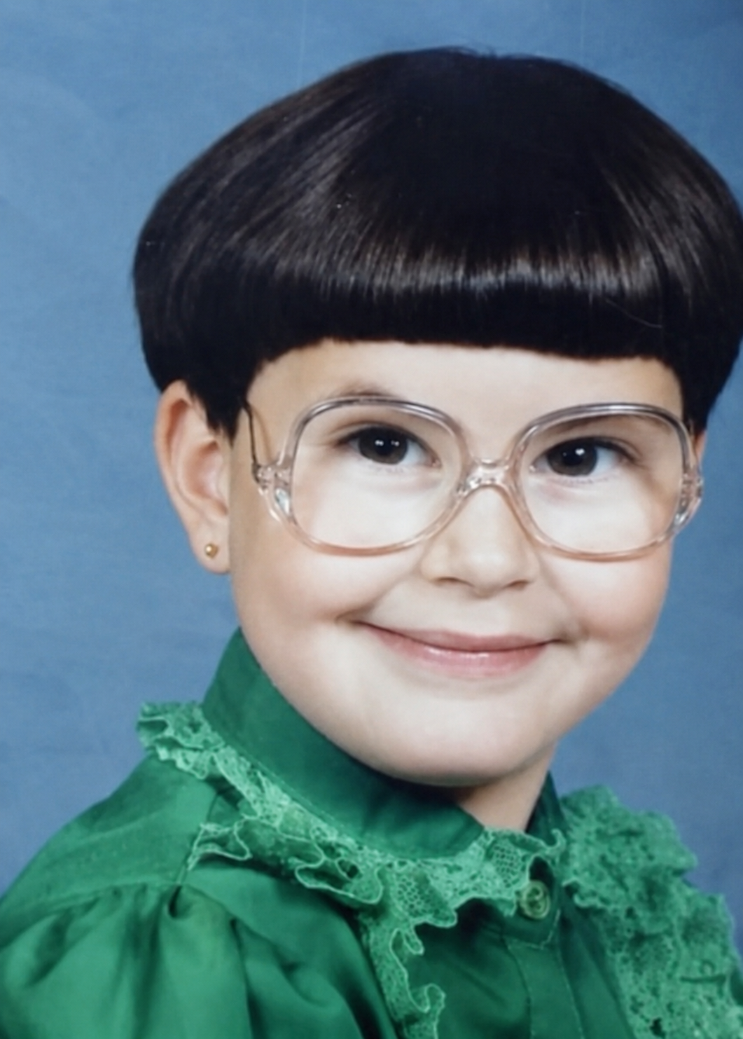 Vintage school portrait of a kid with a bowl cut haircut